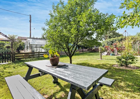 The shared garden & alfresco dining area at Trewint Round House, Menheniot