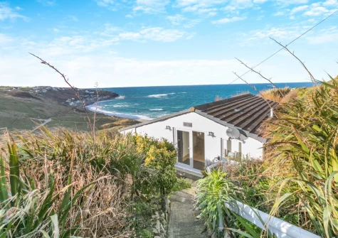 Trewollas Beach Cottage is a stylish &-friendly holiday home perched on top of the hill, with fabulous views of Sennen Cove