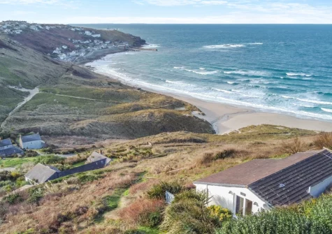 There is a private path to the beach, accessed directly from the patio, and an external shower together with hooks for wetsuits