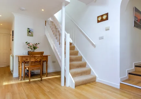 The entrance hallway & stairs up to the first floor at Tripolitania, Porthleven