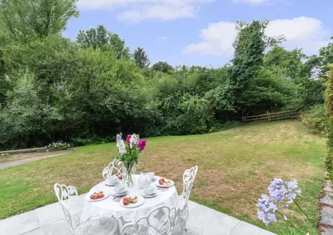 The patio, alfresco dining area & gaden at Troutstream, St Breward