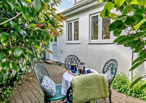 Enjoy outside seating on the private rear patio at Tuckaway Thatch, Mithian