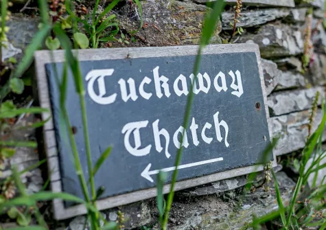 Tuckaway Thatch is nestled within a lovely mature garden