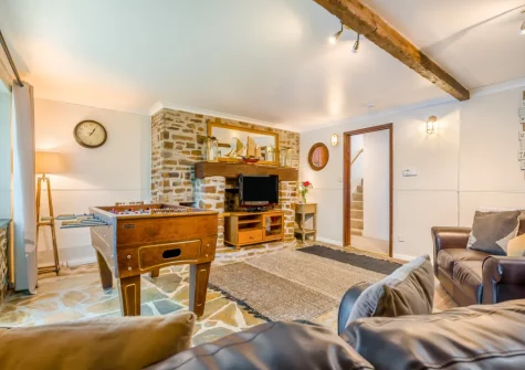 The cozy snug, with football table, at Tumbles Lodge, Hersham