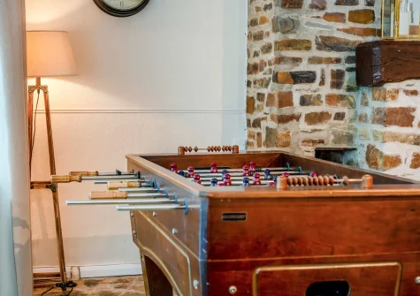 The cozy snug, with football table, at Tumbles Lodge, Hersham