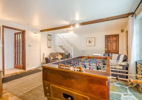 The cozy snug, with football table, at Tumbles Lodge, Hersham