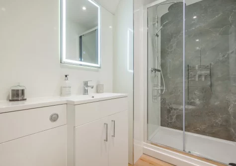Bedroom #3 en-suite shower room at Tumbles Lodge, Hersham
