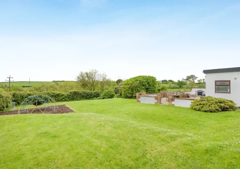 The lawned garden at Tumbles Lodge, Hersham