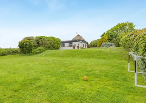 The lawned garden at Tumbles Lodge, Hersham