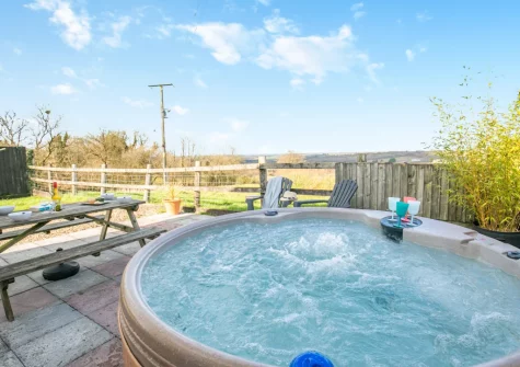 The patio, barbecue, alfresco dining area & hot tub at Twitchers Itch, Chilla