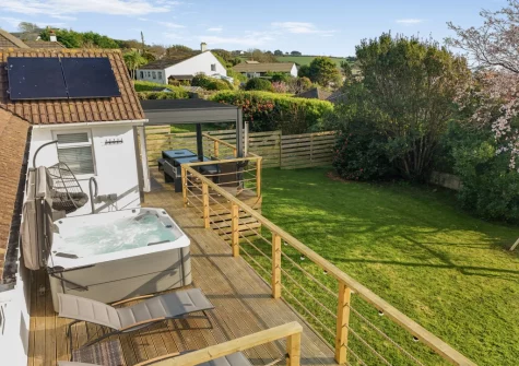 The decked terrace, hot tub & enclosed garden at Two-Ways, Praa Sands