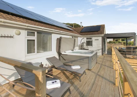 The decked terrace, outdoor sitting area & hot tub at Two-Ways, Praa Sands