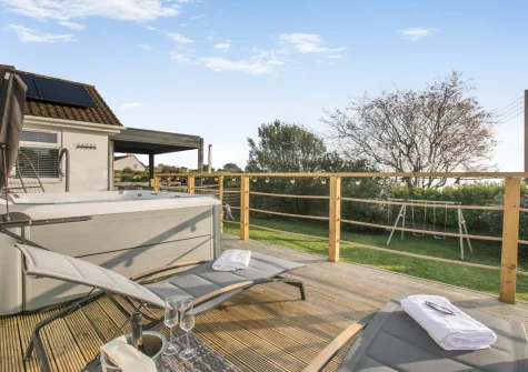 The decked terrace, outdoor sitting area & hot tub at Two-Ways, Praa Sands