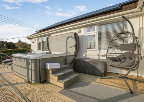 The decked terrace, outdoor sitting area & hot tub at Two-Ways, Praa Sands