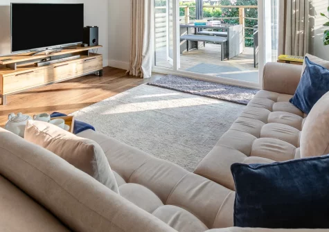 Two-Ways, Praa Sands is a spacious single-storey retreat moments from stunning Praa Sands Beach, featuring a private hot tub with distant sea views, flexible three-bedroom accommodation, and an enclosed garden perfect for families and dogs.