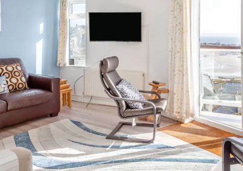 Upper Seafarer, 45 Fore Street, St Ives is a bright two-bedroom apartment with spectacular harbour and bay views, featuring a private terrace for alfresco dining, contemporary open-plan living, and the beaches and cobbled streets of St Ives below.