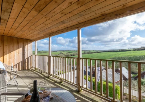 Enjoy far reaching countryside view from bedroom #1 & #2 balcony & outdoor sitting area at Urchins Peak, Little Petherick