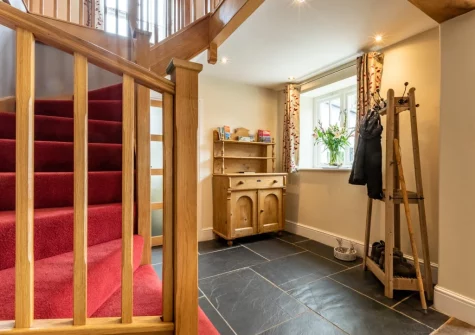 The entrance hallway & stairs up to the first floor at Vale House, Lydford