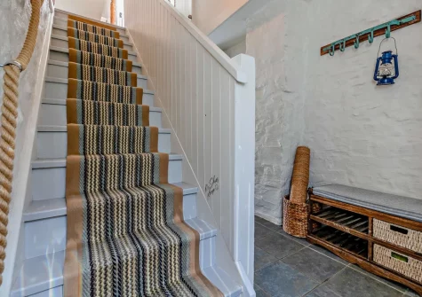 The entrance hallway & stairs up to the first floor at Valley View, Woodford