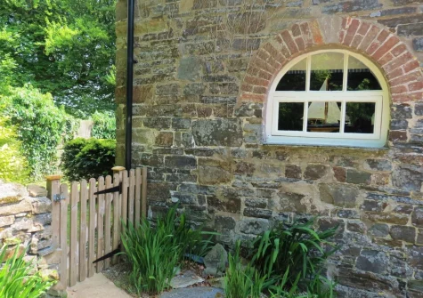 The enclosed private garden via a gate to the side of the property