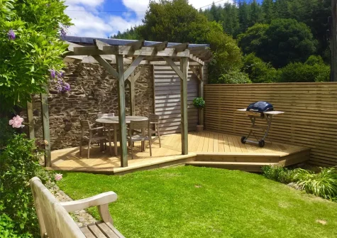 The garden, decked patio & alfresco dining area at Valleys End, Weare Giffard