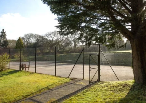 The shared tennis court at The Valley, Carnon Downs