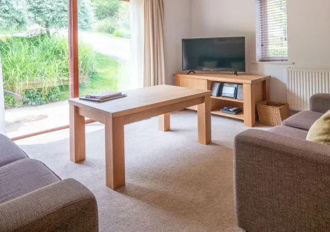Villa Gallery 18 at The Valley, Carnon Downs is a charming two-bedroom cottage set within thirteen acres of tranquil Cornish woodland, with a private balcony, beamed ceilings, on-site pools and spa, plus easy access to Truro and Falmouth.