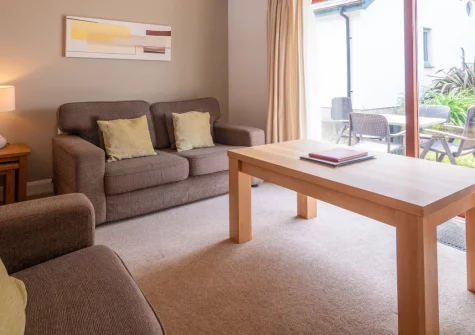 Villa Gallery 8 at The Valley, Carnon Downs is a charming two-bedroom cottage set within thirteen acres of lush Cornish gardens and woodland, featuring a private balcony, resort pools and spa, plus easy access to both Truro and Falmouth.