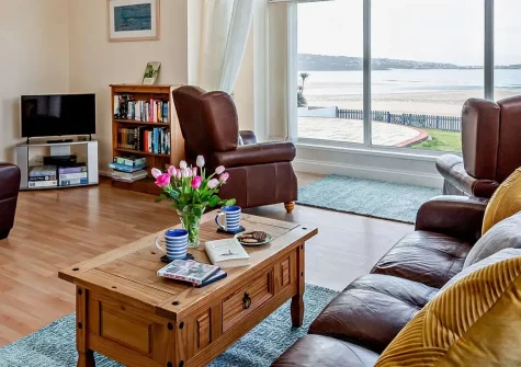 Villa Surfside, Phillack is a stunning clifftop retreat with breathtaking panoramic bay views. Enjoy direct beach access, coastal path walks, and exploring Cornwall's rich heritage and attractions. Perfect for families seeking seaside magic.