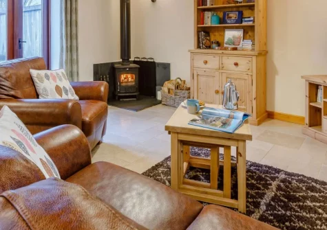 Vines Cottage, Edistone is a charming one-bedroom barn conversion on the Hartland Heritage Coast, with a cosy wood burner, rustic character, and easy access to North Devon's finest beaches and wild coastal walks, perfectly suited for couples.