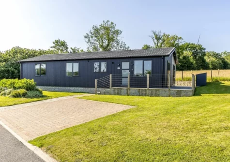 Violet Lodge, 11 Roadford Lake Lodges is a generously sized four-bedroom holiday home with views over open fields