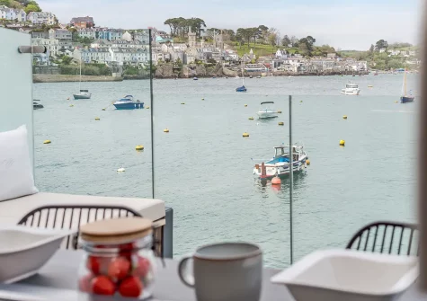 Enjoy stunning views from the patio & breakfast bar at Waters Edge, Polruan