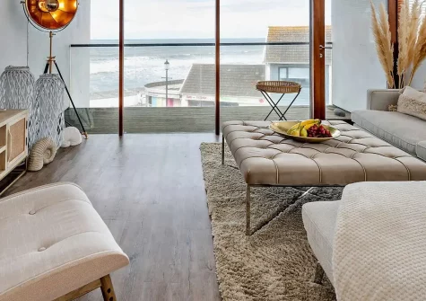 Waters Edge Retreat, Westward Ho! is a stunning 3-bedroom beachfront apartment with panoramic sea views, multiple private balconies, and contemporary style. Perfect for families seeking coastal luxury and creating unforgettable memories.