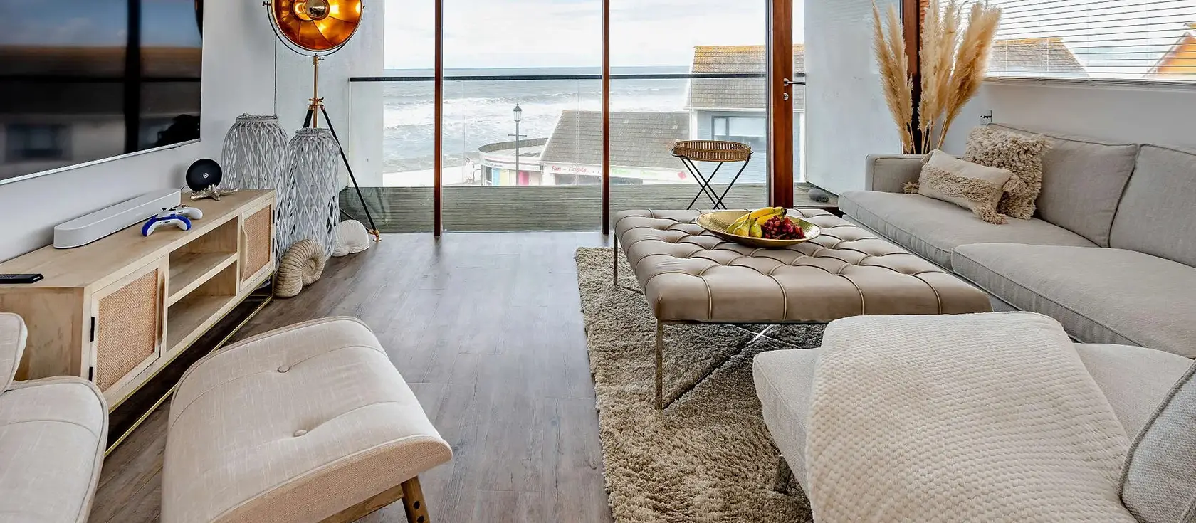 Waters Edge Retreat, Westward Ho! is a stunning 3-bedroom beachfront apartment with panoramic sea views, multiple private balconies, and contemporary style. Perfect for families seeking coastal luxury and creating unforgettable memories.