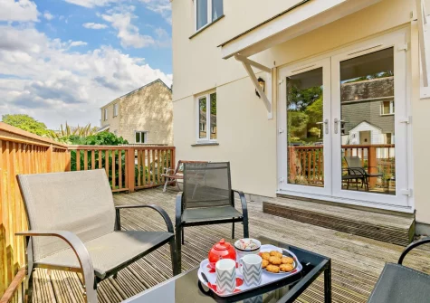 The decked terrace & outdoor sitting area at Waterside at Pendra Loweth, Falmouth