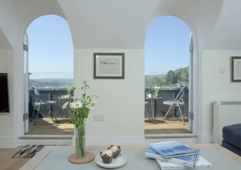 The living room at Waterview House, Kingswear opens out on to a fabulous roof terrace