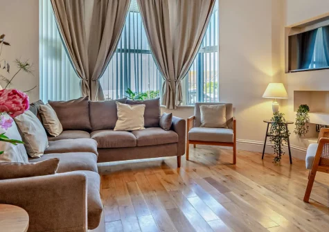 Wave Watch, Newquay is an impressive four-bedroom townhouse overlooking Towan Beach and the harbour, featuring a master balcony with ocean views, contemporary coastal interiors, and direct access to Newquay's surf beaches and dining scene.
