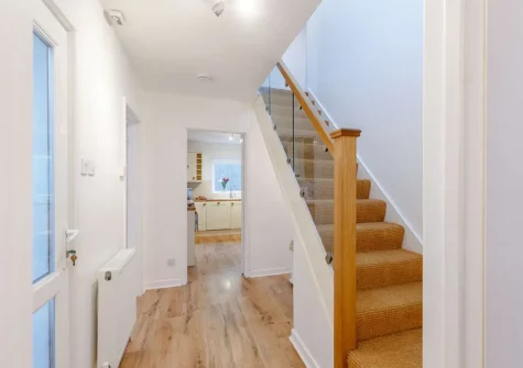 The hallway & stairs to first floor at Waves End, Babbacombe