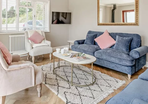 Wayside, Saunton, is a stunning four-bedroom coastal retreat with breath-taking sea views. Enjoy a luxurious hot tub, wraparound terrace, and direct access to golden beaches. Perfect for families seeking an unforgettable seaside holiday escape.