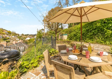 The patio & alfresco dining area at Wednesday Cottage, Helford