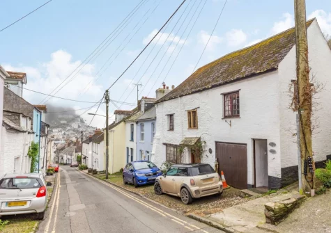 Wenmouth Cottage is accessed via a covered alleyway into a small communal courtyard