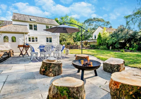 The patio, barbecue, alfresco dining area & large south facing garden at West Cottage, Trescowe