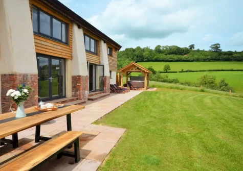 The patio, alfresco dining area & garden at West Farleigh Barn, Cadeleigh