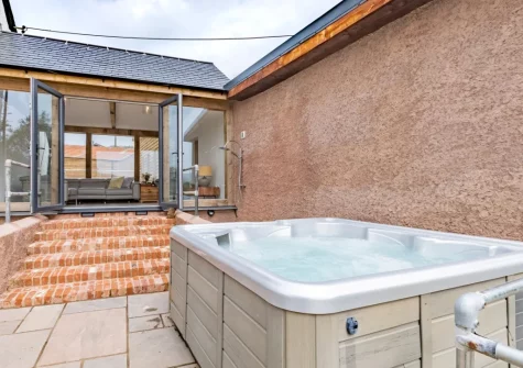 The terrace & hot tub at West Farleigh Farmhouse, Cadeleigh