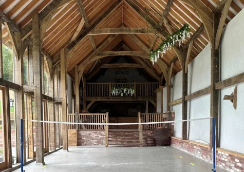 The shared indoor badminton court & games room at West Farleigh Farmhouse, Cadeleigh