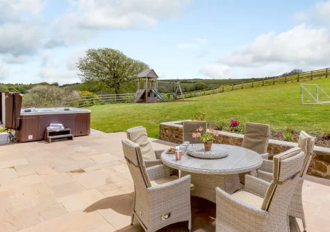 The patio, barbecue, alfresco dining area & hot tub at West Park, Herodsfoot