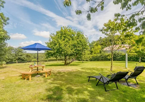 The garden & alfresco dining area at West Pennicknold Barn, Shebbear