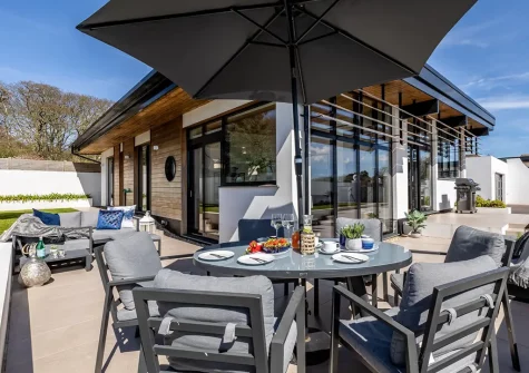The terrace, alfresco dining & outdoor sitting area at West Pine Villa, Tehidy