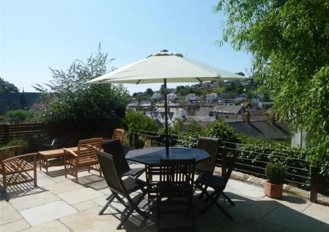 The sun-trap patio, barbecue & alfresco dining area at West View Cottage, Beer