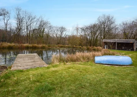 The wildlife pond and undercover dining area at West Yard Cottage, Ashreigney